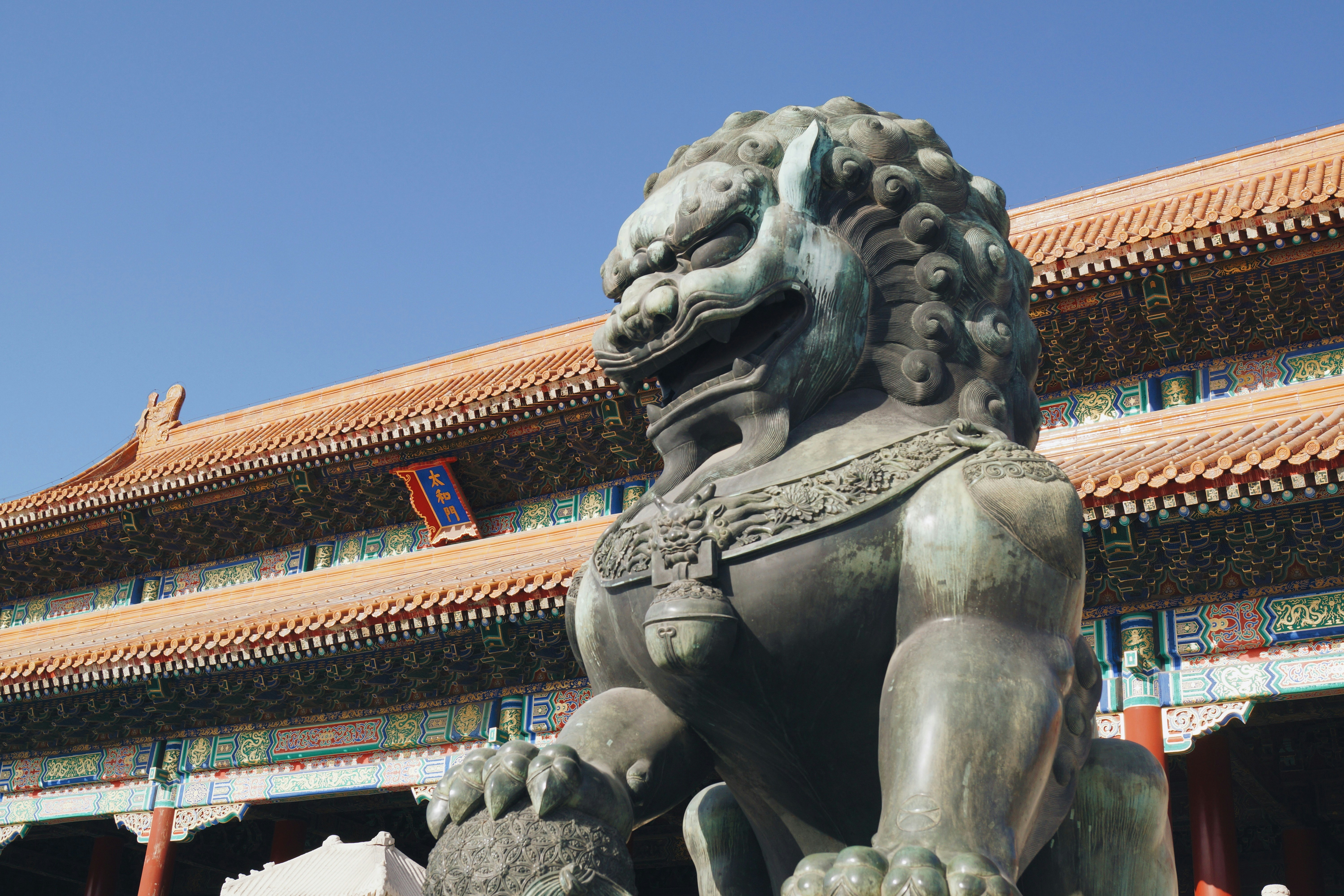 brown animal statue in front of temple